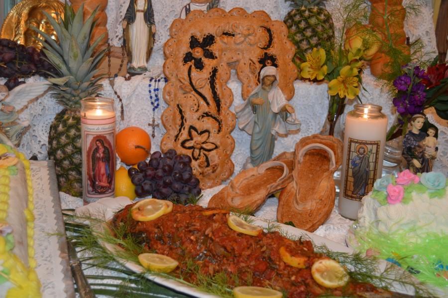 In keeping with tradition, flowers, fish, fruit, vegetables,  and wheat products in the form of decorative breads and pastries are placed on the Altar along with statues and candles. 