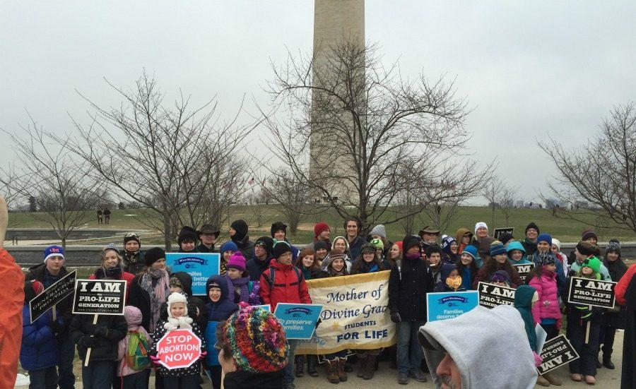 Mother of Divine Grace students gathered in front of the Washington Monument before March for Life in 2015.  