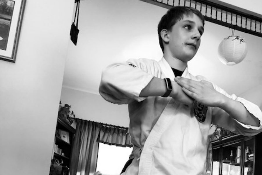 I took this picture of my brother. The form he is in is called 'set' and it's purpose is the final position of an assault on the head. He is a Blue Belt and has been doing it for 2 and 1/2 years.
I took the picture with an iPhone 8 with the Black and White Filter.