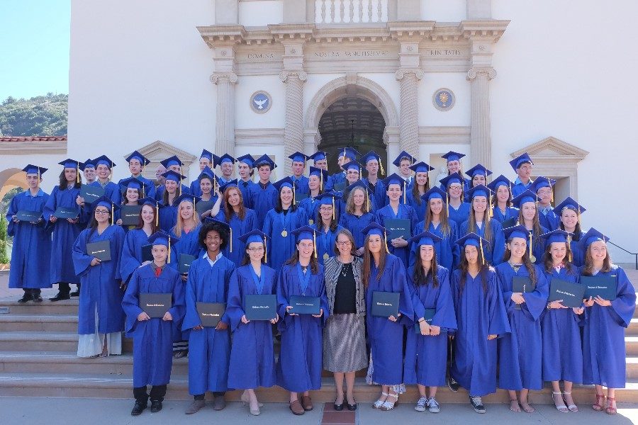 Graduates stand with Laura Berquist at the first MODG graduation at TAC.  Photo Credit Gwynith Hayden.