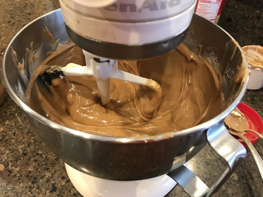 Beat peanut butter and butter in a mixer. Once combined, add vanilla extract. 