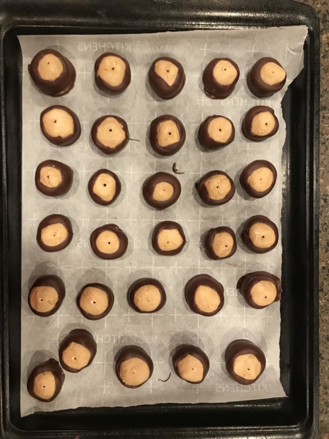 Place buckeyes on a wax paper lined cookie sheet until chocolate is set. 
