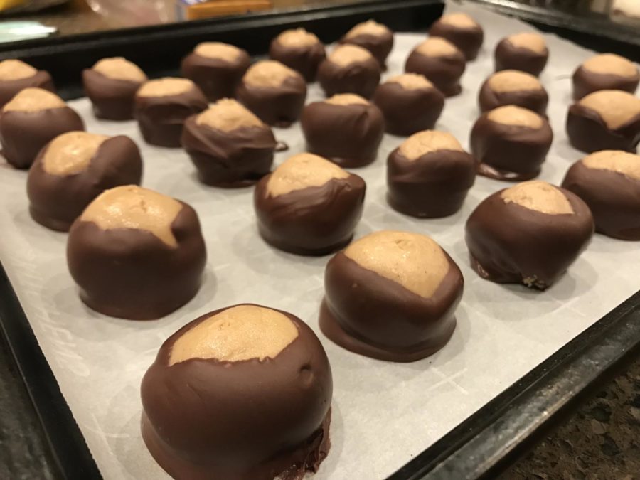 Place buckeyes on a wax paper lined cookie sheet until chocolate is set. 