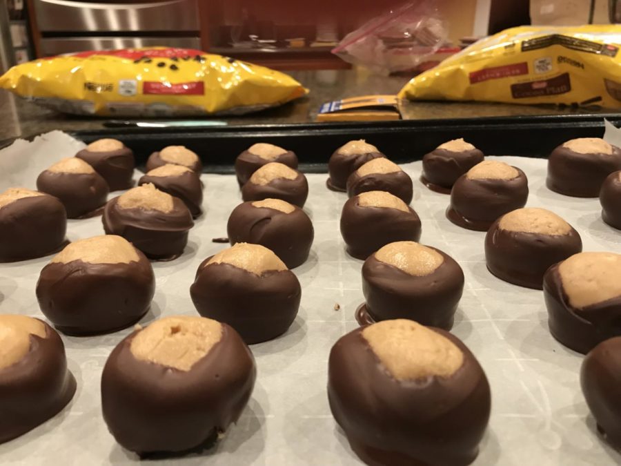 Place buckeyes on a wax paper lined cookie sheet until chocolate is set. 