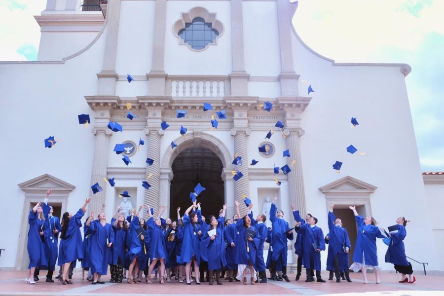 Graduates joyfully toss their hats outside the Thomas Aquinas College Chapel. This years graduation will be the third graduation for Mother of Divine Grace.