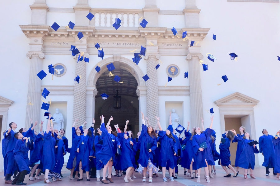 The MODG graduating class of 2017 toss their hats after graduating. 
