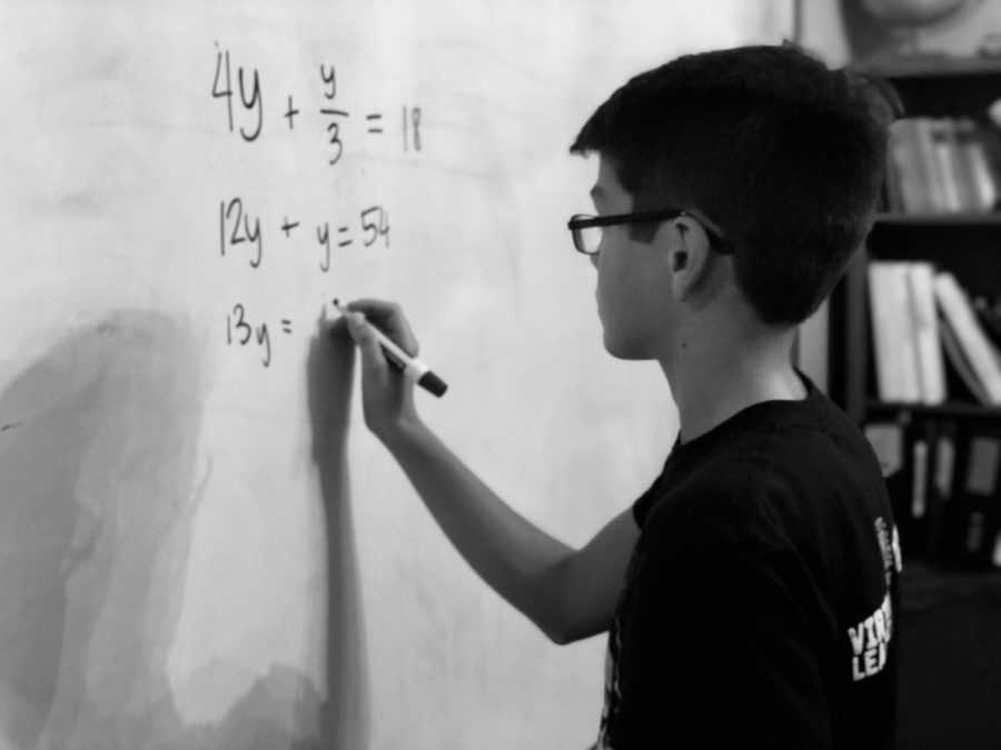 MODG ninth-grader 
Jonathan Ledoux works on math at home.