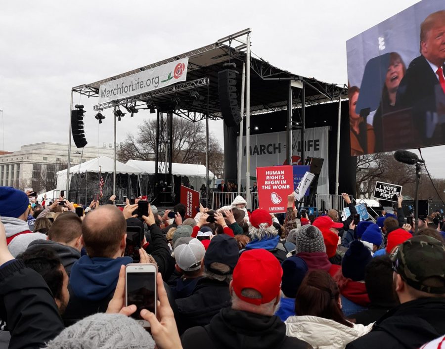 President Trump is on the podium at the March for Life. He is the first president to attend the March.