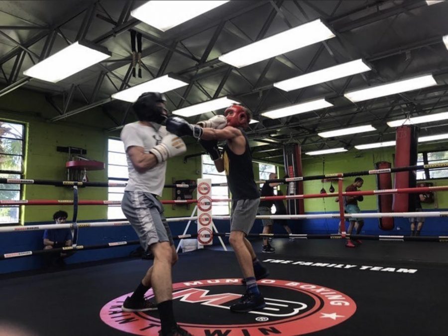 (Me in the red helmet) attempting to throw a jab as he jabs me