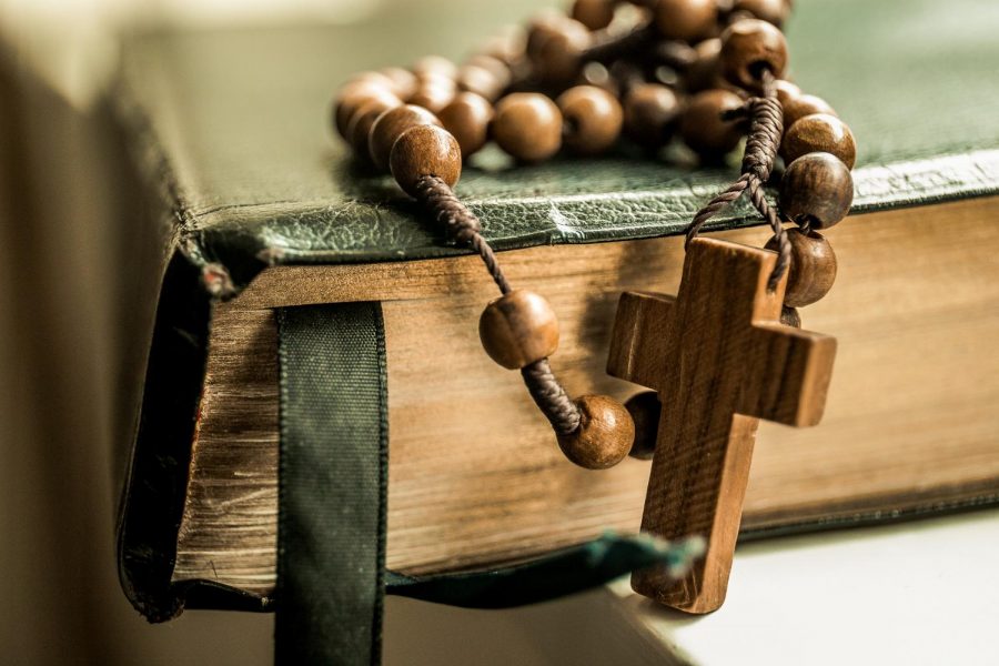 Picture of a Bible and Wooden Rosary // https://unsplash.com/license