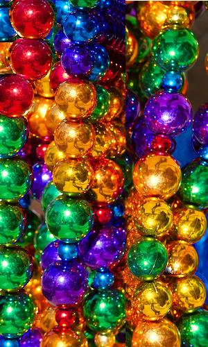 Mardi Gras Beads // https://commons.wikimedia.org/wiki/File:Mardi_Gras_beads_metallic_style.jpg // Permission to use under license CC BY-SA 2.5.