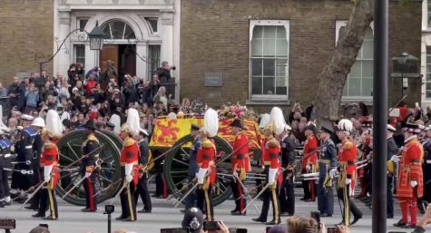 Queen Elizabeth IIs casket, draped with the Royal Standard, is visible in this video screenshot.