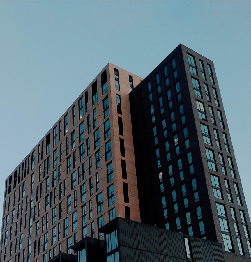 An apartment complex on a clear evening.